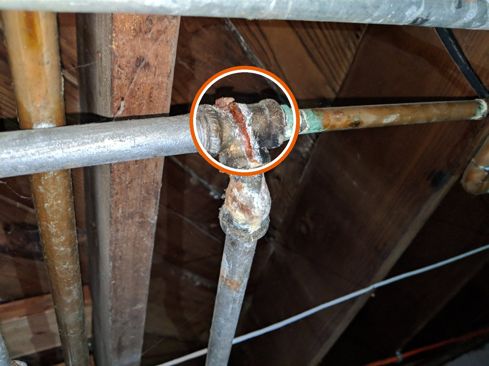 Galvanized steel water pipe, rusted at the fittings