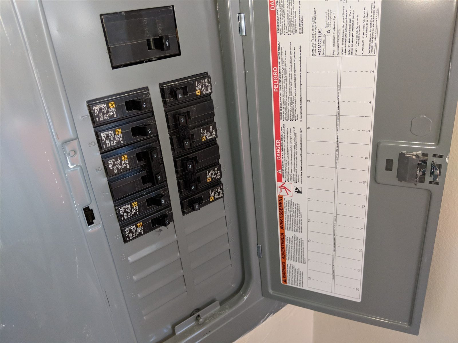 Main electric panel · 100-amp main breaker
